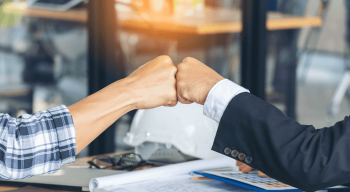 1639411705-mbs-teamwork-fist-bump-office-gi-1272345119-16-9