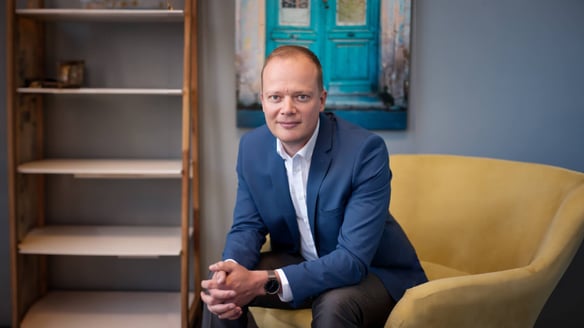 Kornelis Miske sitting in a chair