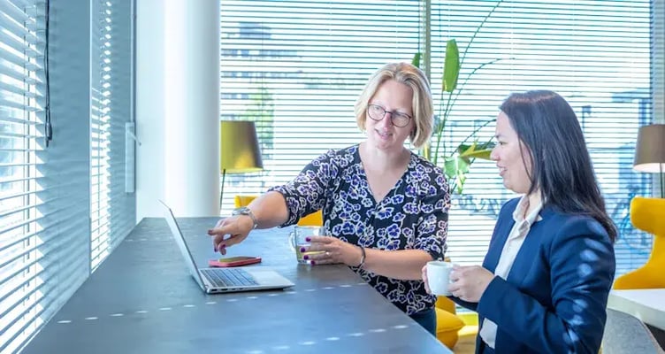 Woman behind the computer.
