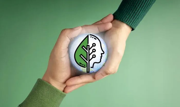 twee handen die samen een wereldbol vasthouden met daarop een illustratie van een hoofd en een blaadje