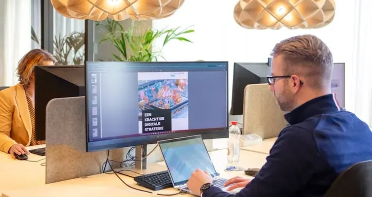 Man behind computer.