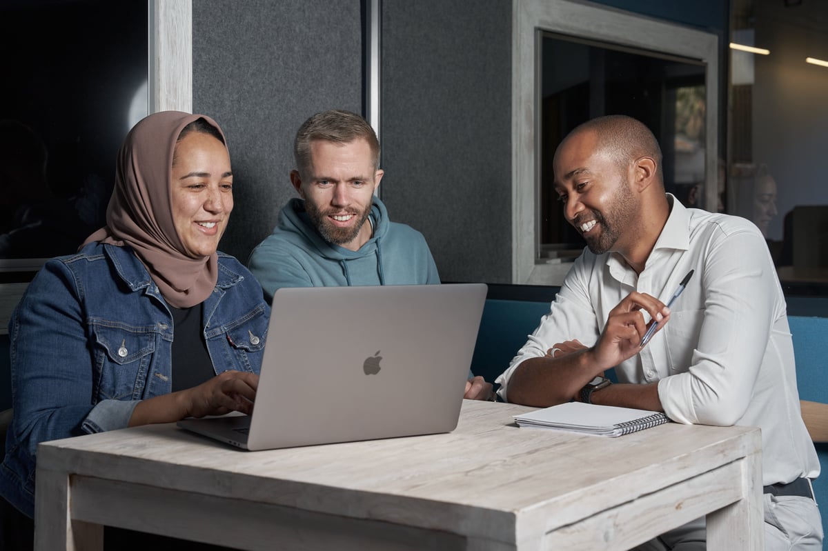 Three Lalandi colleagues working together at a laptop