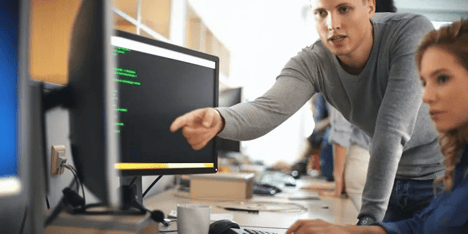 man-points-at-screen