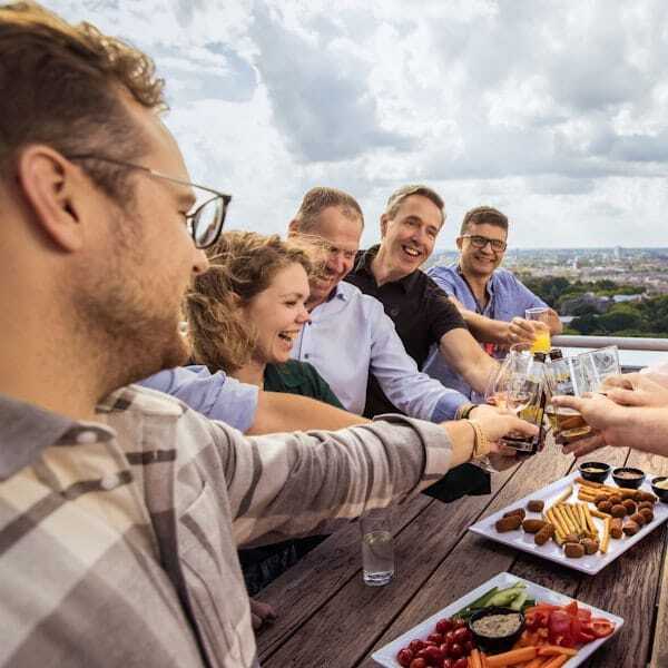Colleagues are having drinks and toasting.